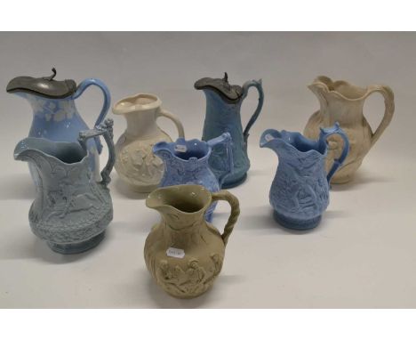 A collection of mid 19th Century pottery jugs with relief moulded decoration, various makers including T R Boote, Ridgway, Co