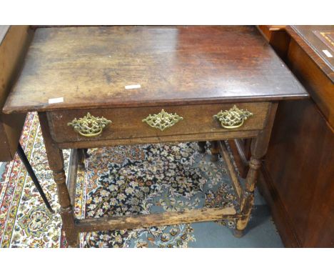 An 18th Century oak single drawer side table raised on bobbin turned legs with all round base stretcher, 86cm wide