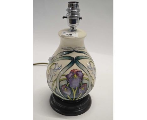 A Moorcroft table lamp with tubelined decoration in the Sorrows &amp; Laughter pattern