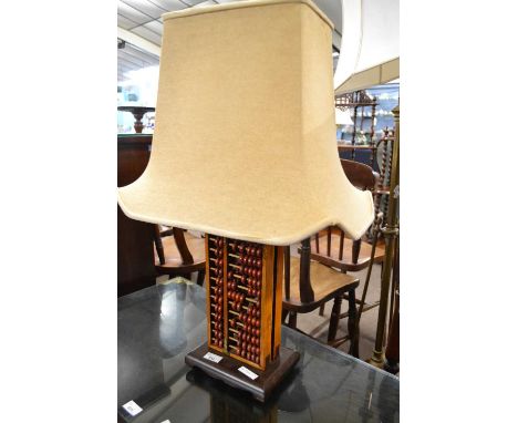 A contemporary Chinese table lamp, the stem formed as an abacus, 73cm high