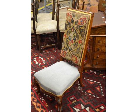 A Victorian high back prayer chair with tapestry back panel and plain fabric seat raised on short carved scrolled legs, 98cm 