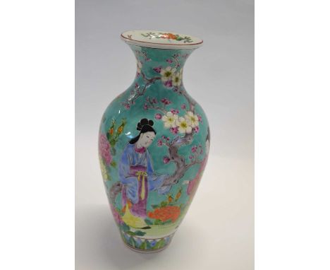 A late 19th Century Chinese porcelain vase with polychrome decoration of ladies on a light green ground with famille rose flo