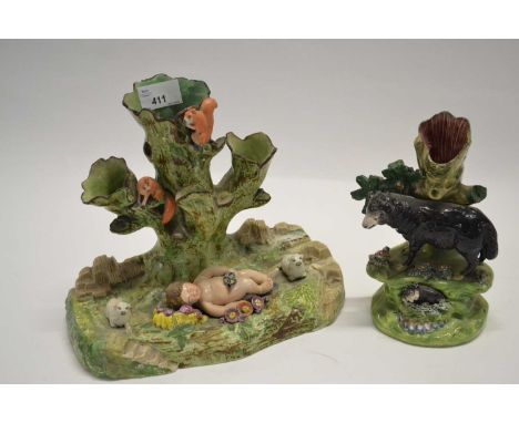A rare large scale Pearl ware tree trunk group modelled as a cherub asleep flanked by lambs, the tree trunk above with squirr