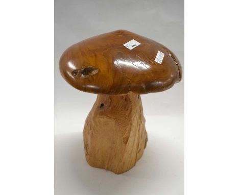 A carved wooden model of a toadstool with polished top, 35cm high