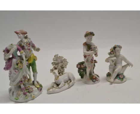A group of four English porcelain figures including a Derby group (head missing from lady), two Bow porcelain cherubs and a D