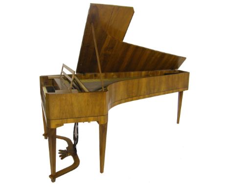 A grand piano, circa 1815, the case veneered in walnut and with bevelled front corners, the six octave keyboard, compass, FF 