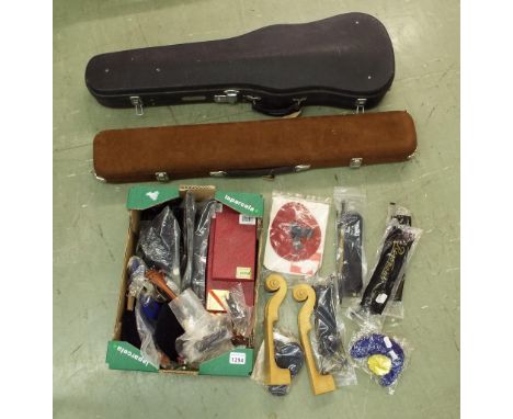 Quantity of various stringed instrument fittings, including chin rests, tailpieces, violin necks, rosins and a quantity of vi