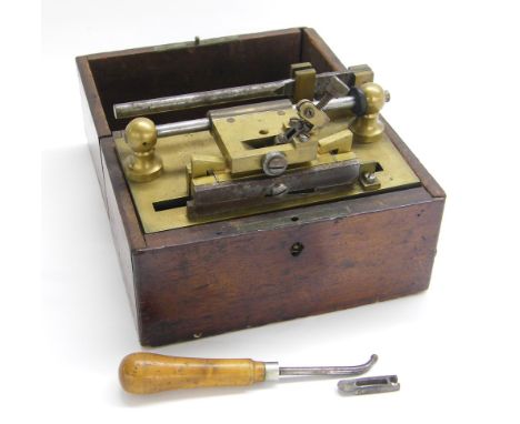 19th century oboe reed cutting tool, the brass bed plate signed Poudra, R. De La Bucherie 9, France within a fitted wooden bo