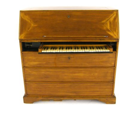 A bureau organ, north German, mid-18th century, the case of mahogany, the fall front opening to reveal some of the pipework, 