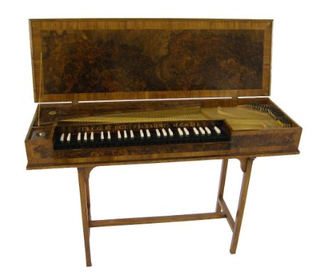 A small unfretted clavichord by Thomas Goff and Joseph Cobby, London, 1952, the case of burr walnut with kingwood crossbandin