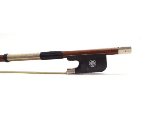 Silver mounted violoncello bow, unstamped, the stick octagonal, the ebony frog inlaid with silver rings enclosing pearl eyes 