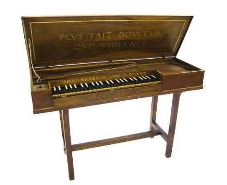 A small unfretted clavichord by Arnold Dolmetsch, Haslemere, 1929, the case of walnut with gilded mouldings and shaped brass 