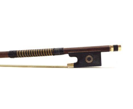 English gold mounted violin bow by and stamped Garner Wilson, the stick round, the ebony frog inlaid with two gold rings to e