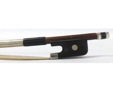 French silver mounted violoncello bow stamped G. Fournier, the stick round, the ebony frog inlaid with pearl eyes and the ebo