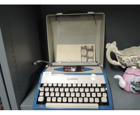 A vintage typewriter in teal blue made by Imperial