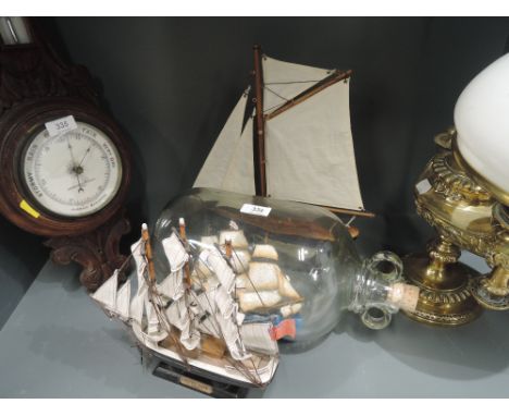 A selection of vintage model galleon sail boat and boat in a bottle