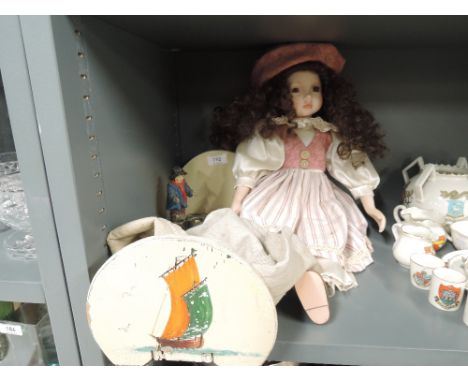 A miscellaneous selection including collectors doll, a book trough and a small battery light