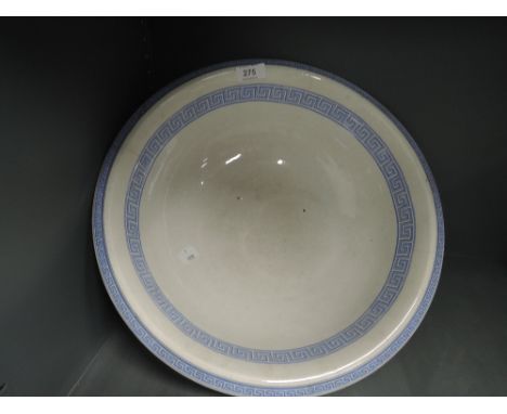 A vintage wash bowl with greek style print marked antique to base
