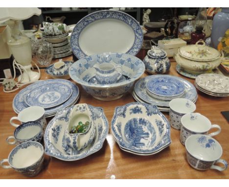 A large selection of blue and white tableware including Johnson Bros, Spode etc