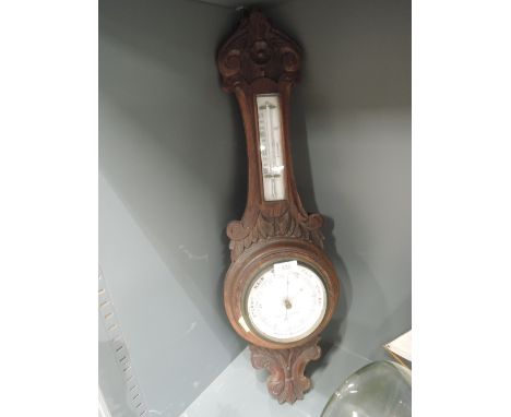 A vintage wall mounted banjo style Aneroid barometer by Joseph Wood and co