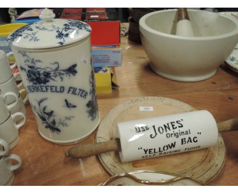 A selection of kitchenalia including a ceramic 'The Berkfield Filter' an advertising ceramic rolling pin featuring advertisin