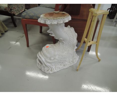 A decorative planter stand, modelled as fish