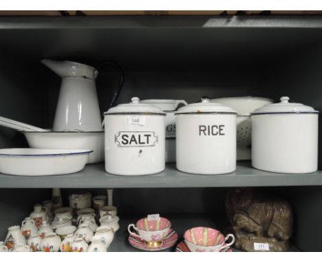 A large collection of enamel kitchenalia including storage pots, jug, bowls etc
