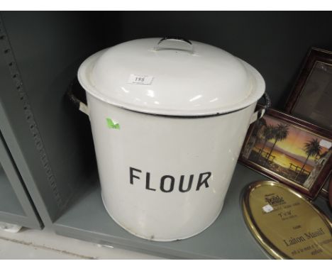 A large enamel flour bin