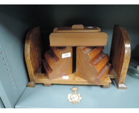 A vintage wooden extendable book shelf or trough and book ends similar