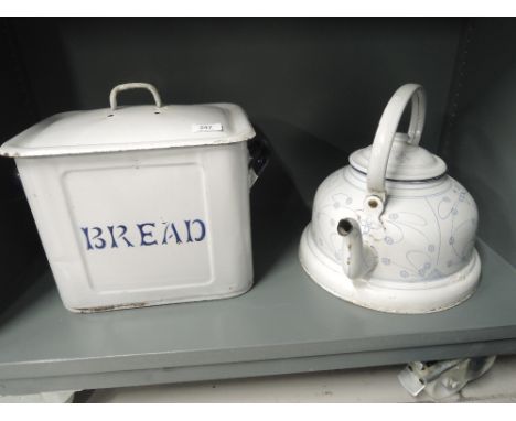 A vintage tin and enamel bread bin, also similar stove kettle with art nouveau style print