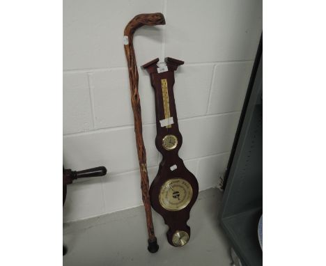 A vintage wall mounted banjo style barometer and hawthorn walking stick