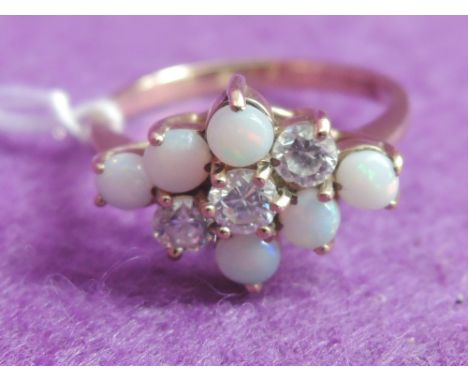 A lady's dress ring having a cubic zirconia and faux opal diamond shaped cluster in a raised claw mount on a 9ct loop,  size 