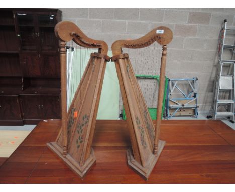 A pair of decorative harp instruments ideal for display