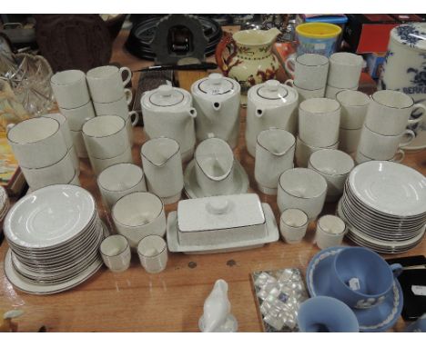 A large selection of tea cups saucers and teapots etc by Poole pottery 50 pieces approx