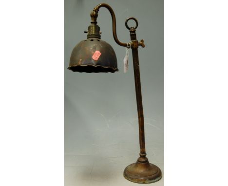 An early 20th century lacquered brass desk lamp with rise-and-fall action 