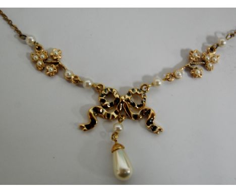 An Edwardian style gilt metal and faux pearl set openwork pendant on finelink necklace 