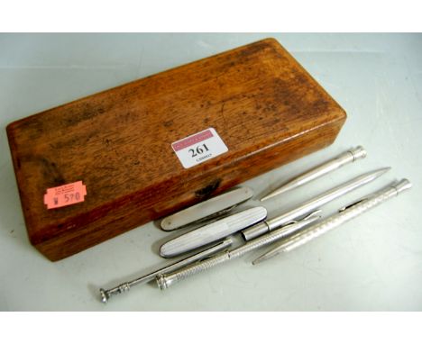 Five silver propelling pencils, together with a mother of pearl fruit knife and one other in mahogany pen box (7) Condition R