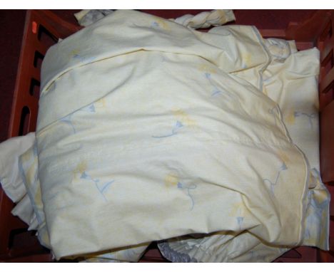 A pair of yellow floral lined curtains, approx 92 x 182cm, with matching pelmet and tie-backs