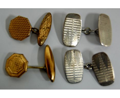 A pair of art deco engine turned silver cufflinks together with a pair of gold plated examples