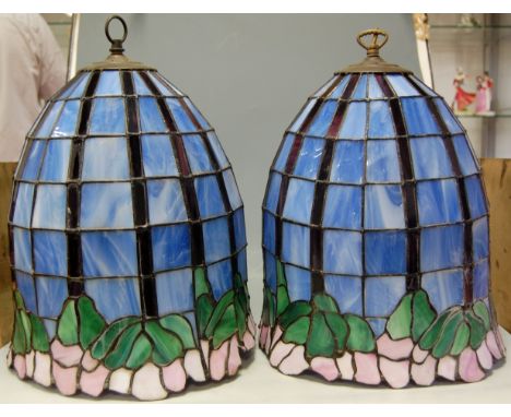A pair of large Tiffany style leaded ceiling light shades Condition Report / Extra Information One with some damage mainly to