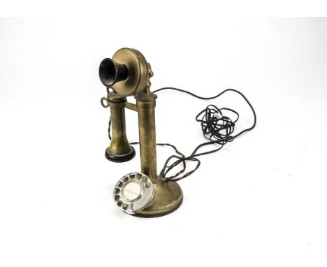 A telephone, a brass candlestick type (no markings), with chromium dial and old and modern wires 