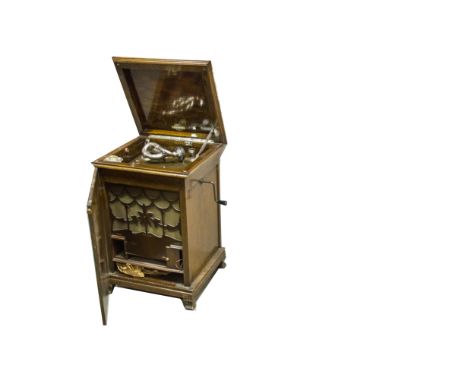 A cabinet gramophone, Gilbert, with Tone Reflector soundbox on bugle tone-arm, turntable light, Gilbert record pad and oak ca