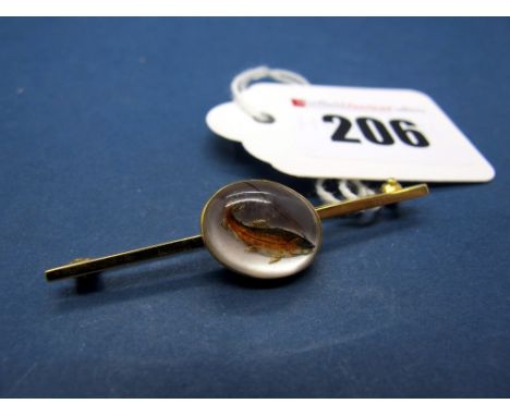 An Essex Crystal Bar Brooch, the oval crystal intaglio carved to depict a fish, oval collet set on plain bar stamped "9ct". 
