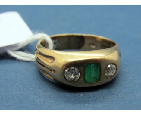 A Continental Emerald and Diamond Three Stone Ring, rectangular rubover set to the centre between two old cut diamonds and re