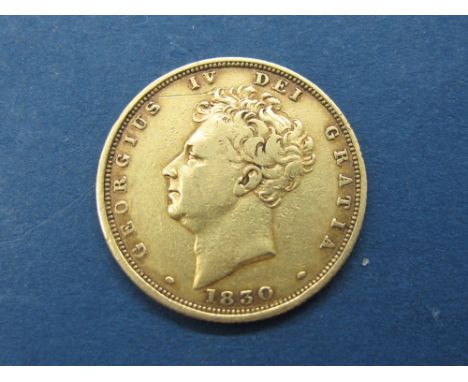 A King George IV Sovereign, 1830, 'bare head' portrait, shield back. 