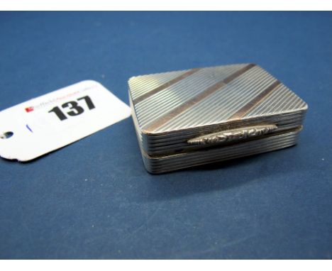 A Hallmarked Silver Pill Box, PJD, Birmingham 1989, allover engine turned with stripe highlights and textured thumbpiece, gil