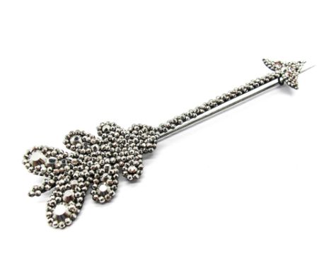 A Large XIX Century Cut Steel Brooch, in the form of an arrow, 16cms long. 