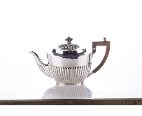 A VICTORIAN SILVER TEAPOT, CHARLES STUART HARRIS, LONDON, 1890 Oval, gadrooned body and hinged cover with ebonised finial, le