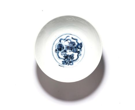 A CHINESE BLUE AND WHITE ‘LION-DOG’ BOWL, MING DYNASTY, WANLI 1573 – 1619 The deep rounded sides rising from a short foot, th