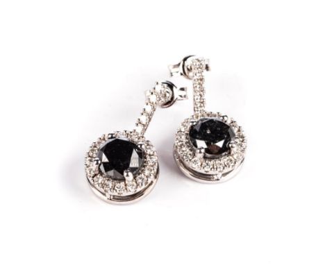 A PAIR OF BLACK AND WHITE DIAMOND PENDANT EARRINGS Each claw-set to the centre with a round black diamond weighing approximat